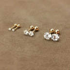 Golden four-prong twisted ball cubic Synthetic Zirconia earrings