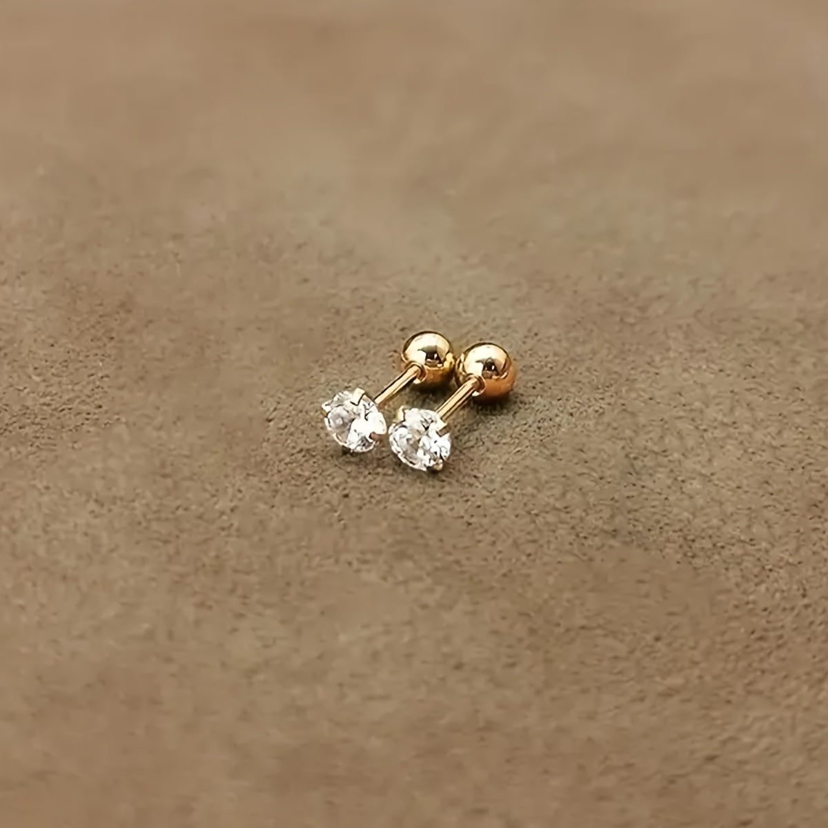 Golden four-prong twisted ball cubic Synthetic Zirconia earrings