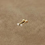 Golden four-prong twisted ball cubic Synthetic Zirconia earrings
