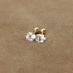 Golden four-prong twisted ball cubic Synthetic Zirconia earrings