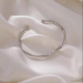 A Sleek And Stylish Twisted Texture Golden Bangle