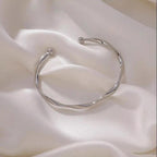 A Sleek And Stylish Twisted Texture Golden Bangle