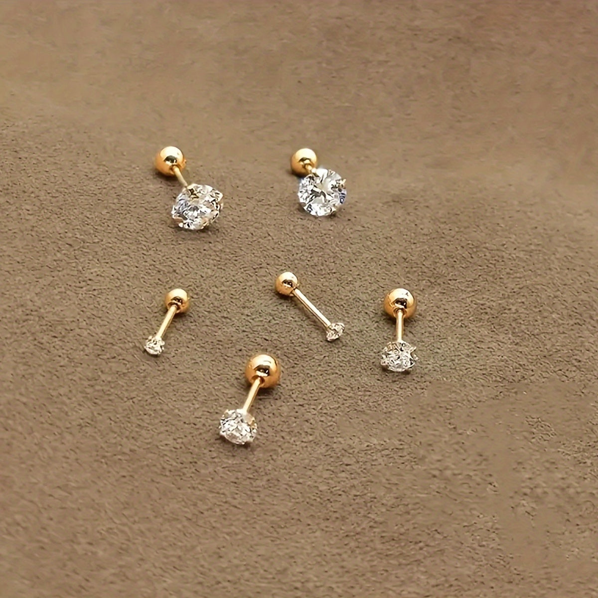 Golden four-prong twisted ball cubic Synthetic Zirconia earrings